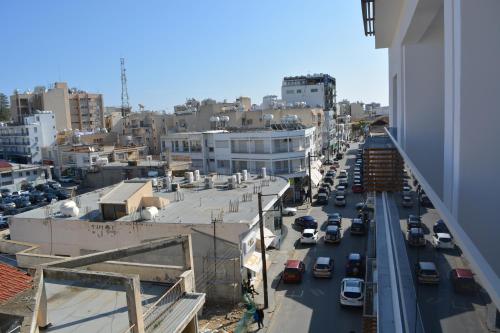 a view of a street in a city with cars at P.L Hermes Studios & Apartments in Larnaka