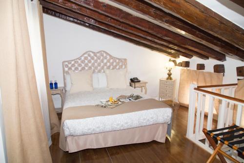a bedroom with a large bed in a room at Oriente Palace Apartments in Madrid