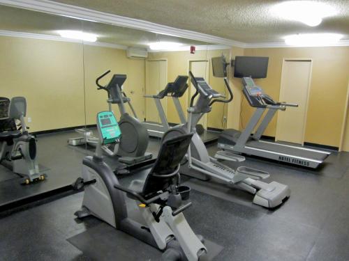 a gym with several tread machines in a room at Extended Stay America Suites - Louisville - Alliant Avenue in Louisville