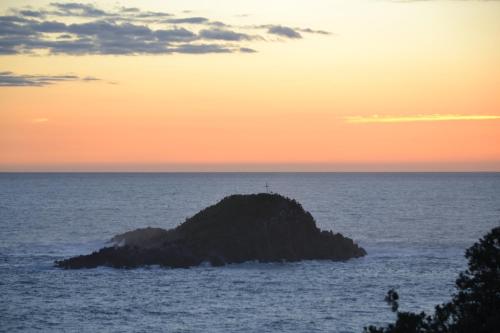 a small island in the ocean at sunset at B&B "LA GIANCARLA" in Maratea