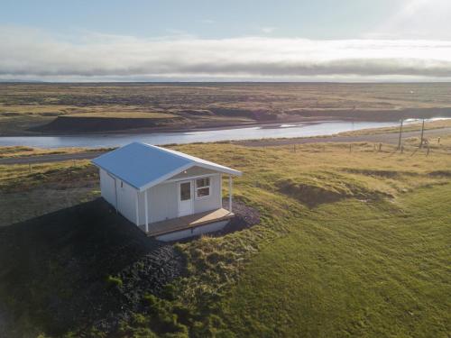 a tiny house on the side of a field at The Holiday Houses by Stay in Iceland in Kirkjubæjarklaustur