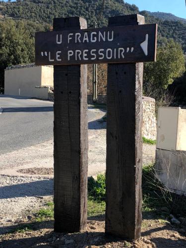 a street sign on the side of a road at U Fragnu in Omessa