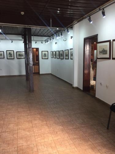 a large room with pictures on the walls at Prenociste DM5 in Novi Pazar