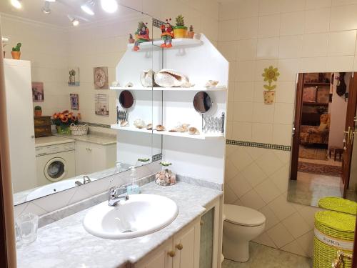 a bathroom with a sink and a toilet at Virginia Redondela in Redondela