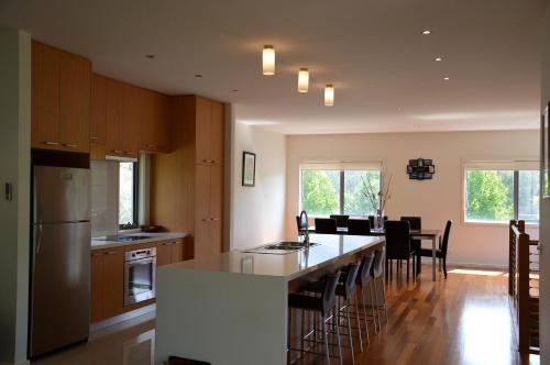 a kitchen with a large island in the middle at The Track - beautiful townhouse in Bright in Bright