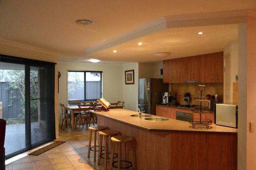 a kitchen with a large island in a room at 12 The Track, Bright in Bright