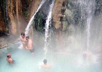 a group of people swimming in a waterfall at Leventis Art Suites in Panayítsa