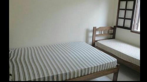 Llit o llits en una habitació de Casas em Boracéia