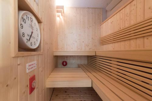 a clock on the wall of a locker room at Yunotani Senkei in Totsukawa