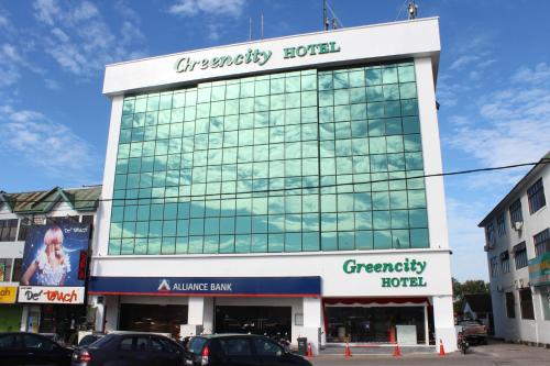 a large glass building with a greenberry hotel at Greencity Hotel in Sungai Petani
