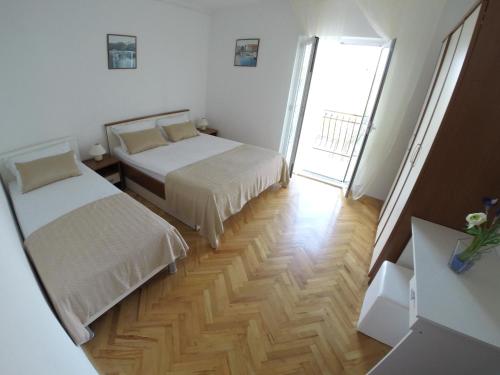 Säng eller sängar i ett rum på Apartments Ljiljana