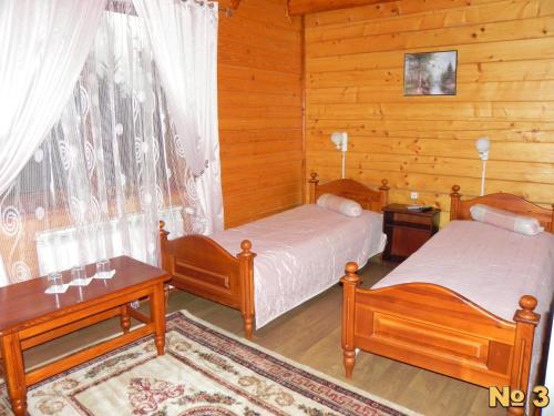 Postel nebo postele na pokoji v ubytování Hotel and restaurant complex Skolmo