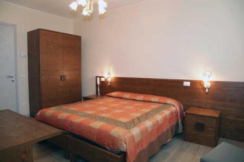 Ένα ή περισσότερα κρεβάτια σε δωμάτιο στο Azienda Agrituristica Ai Prai