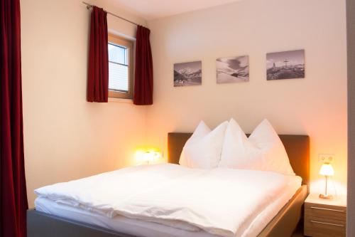 Postel nebo postele na pokoji v ubytování Apart Bergwärts