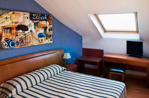 Postel nebo postele na pokoji v ubytování Hostal Villa de Ajalvir