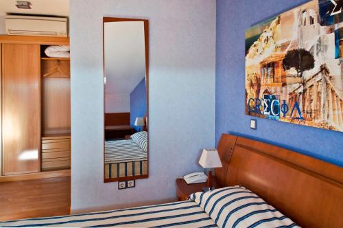 Postel nebo postele na pokoji v ubytování Hostal Villa de Ajalvir