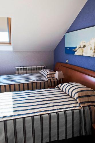 Postel nebo postele na pokoji v ubytování Hostal Villa de Ajalvir
