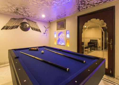 a pool table in a room with a purple ceiling at Umaid Haveli-A Heritage Style Hotel & Resort in Jaipur
