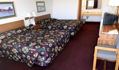 מיטה או מיטות בחדר ב-Yorkshire Motel
