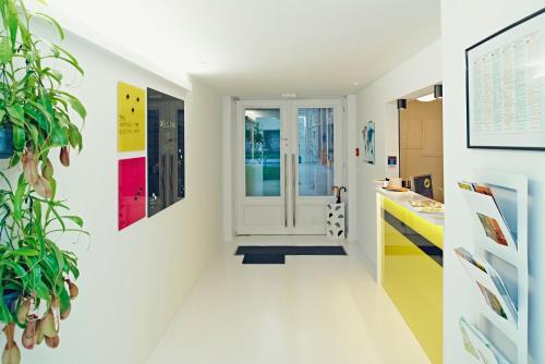 a hallway with colorful art on the walls at Design Studios SVI-MI in Zagreb