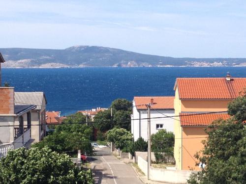 a view of the ocean from a street at Apartments Ban in Novi Vinodolski