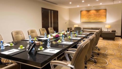 a conference room with a long table and chairs at Boudl Al Tahlia in Jeddah