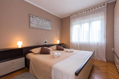 Postel nebo postele na pokoji v ubytování Apartments Come&Stay