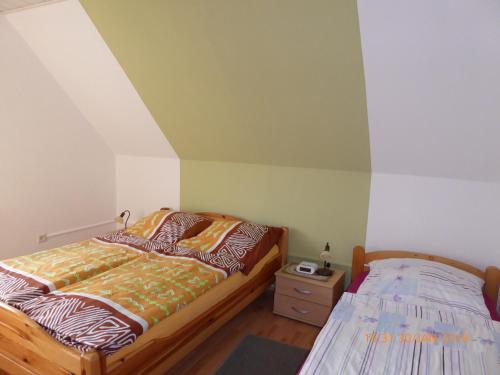 Postel nebo postele na pokoji v ubytování Schmidtfewo Moorgeist