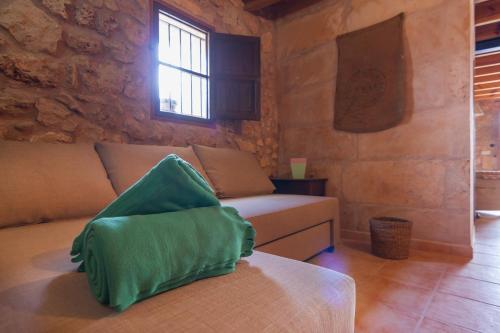 a living room with a couch and a window at Ca Nostra in Algaida