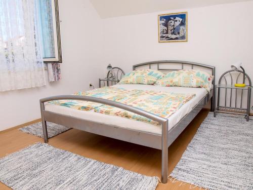 En eller flere senge i et værelse på Apartments Vukovic