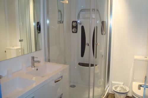 a bathroom with a shower and a sink at Le Collet d'Auron in Auron