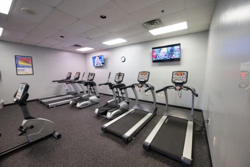 a fitness room with rows of cardio machines at Hope Hotel and Richard C. Holbrooke Conference Center in Fairborn