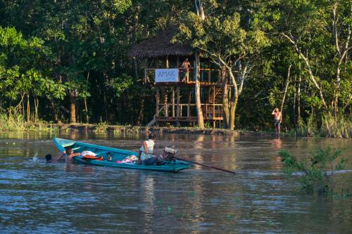 a group of people on a boat in the water at Ämak Iquitos Ecolodge - All Inclusive in Santa Clara
