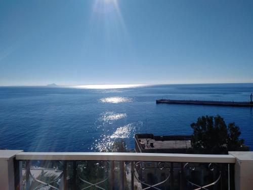a view of the ocean from a balcony at Κastro Ηotel in Agios Kirykos