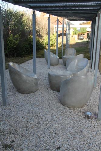a group of concrete bowls sitting on the ground at Aguas de Oro in Villa Gesell