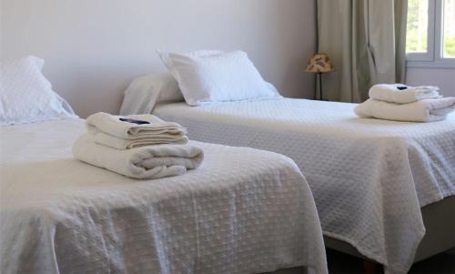 En eller flere senge i et værelse på Breeze Apart Hotel