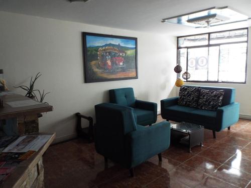 Posezení v ubytování HotelIam Armenia - Encanto y descanso en el corazon del Quindio
