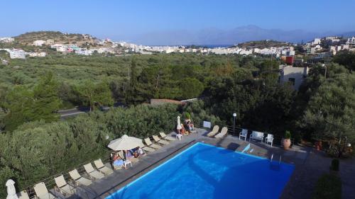 a swimming pool with a view of a city at Golden Apartments in Agios Nikolaos