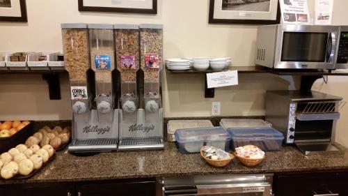 a kitchen with a counter with some food at BCMInns - Lac La Biche in Lac La Biche