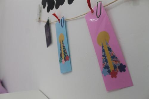 a group of tags hanging from a clothes line at Pousada Orquideas de Maria in Aparecida