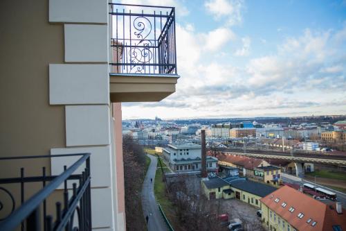 a balcony on a building with a view of a city at Gregory House in Prague