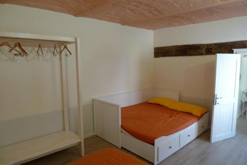a small bedroom with a bed and a closet at Badia in Modena