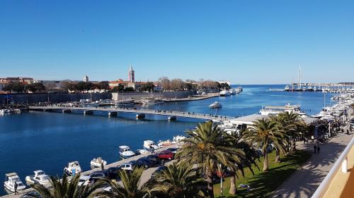 a view of a marina with boats in the water at Apartments Withlove Zadar in Zadar