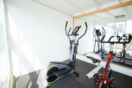 two exercise bikes in a room with a window at The Gallery in Mexico City