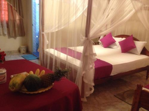 Postel nebo postele na pokoji v ubytování Jaya Home Stay