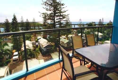 a balcony with a table and chairs and a view at Flightdeck 301 5-7 Clarence Street in Port Macquarie