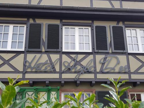 a building with windows and shutters on it at Aigle d'Or - Strasbourg Nord in Reichstett