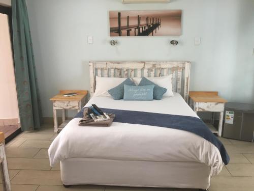 Ένα ή περισσότερα κρεβάτια σε δωμάτιο στο Isle La Breeze Guest House