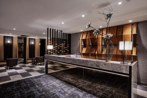 a lobby with a reception desk in a hotel at Kenting City Gate Hotel in Hengchun