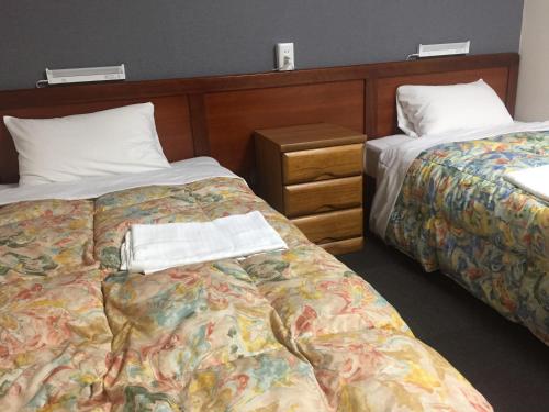 Posteľ alebo postele v izbe v ubytovaní Hotel Todai